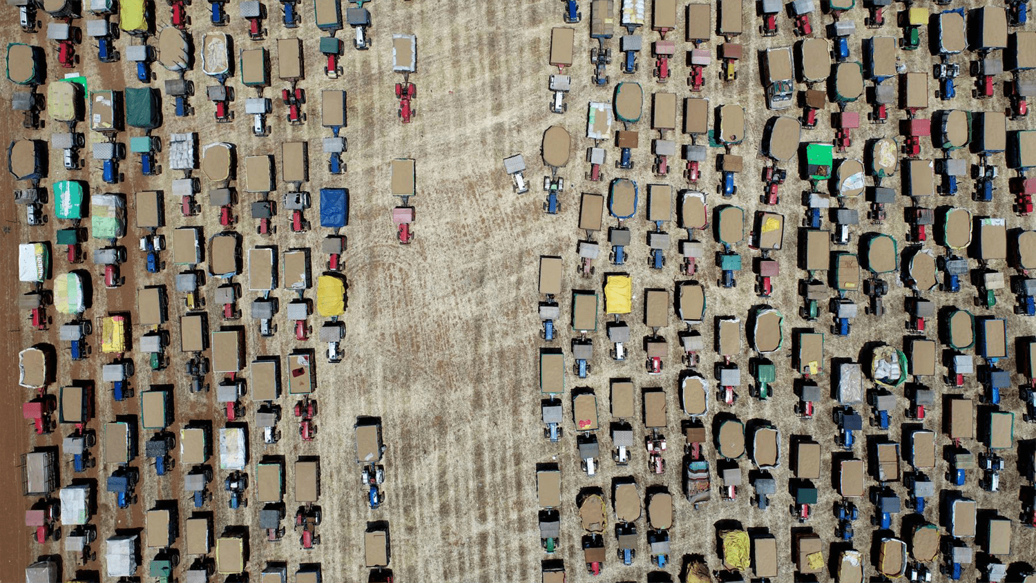 Birdseye view of tractors lined up in rows