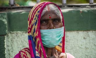 Elderly Indian woman wearing a face mask