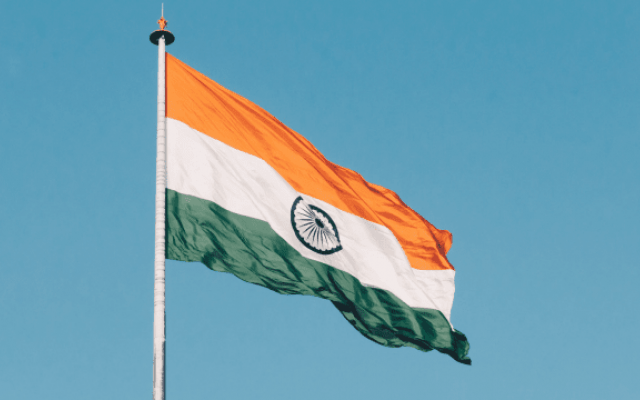 Indian flag against a blue sky