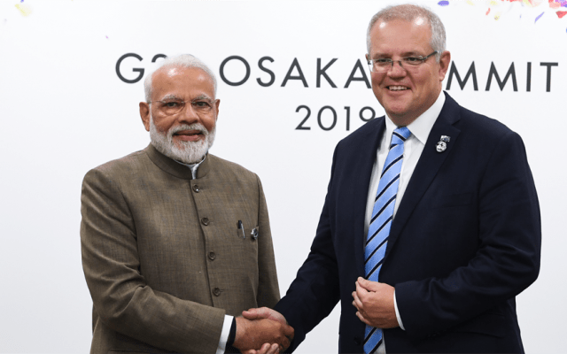 Prime Ministers Scott Morrison and Narendra Modi shaking hands